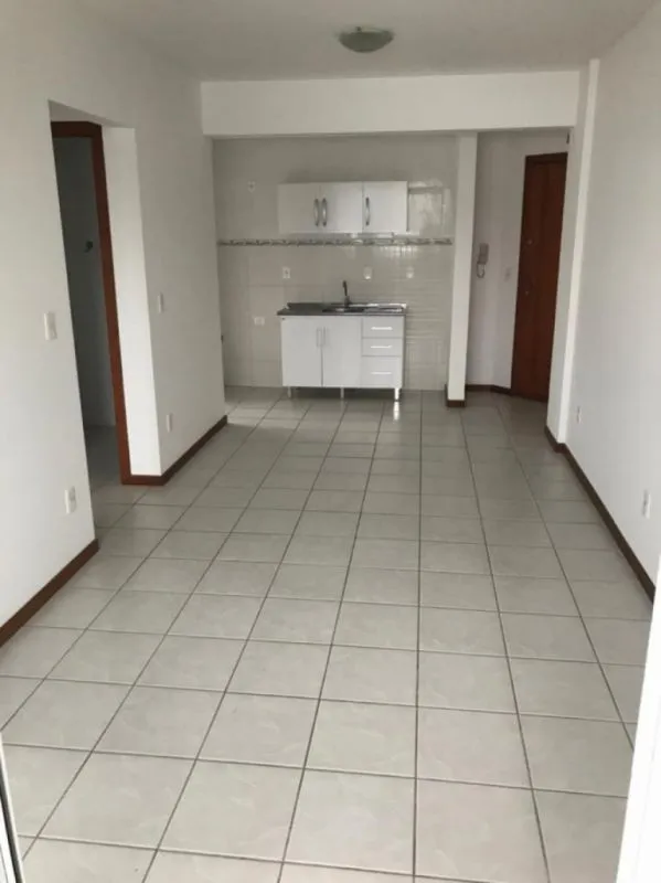 Excelente apartamento com 02 dormitórios, sendo uma suíte, sala, cozinha com moveis sob medida, sacada com churrasqueira, 01 vaga de garagem, arejado e de fácil acesso ao centro. — foto 5