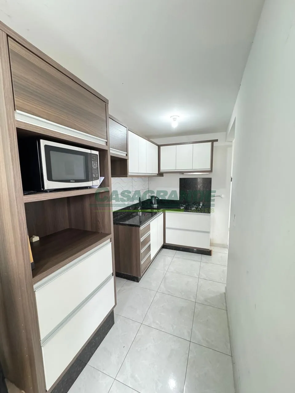 Apartamento no bairro Itoupavazinha, 2 dormitórios, sacada com churrasqueira a carvão, sala de estar e jantar, cozinha com móveis sob medida, área de serviço, 1 vaga de garagem. — foto 7