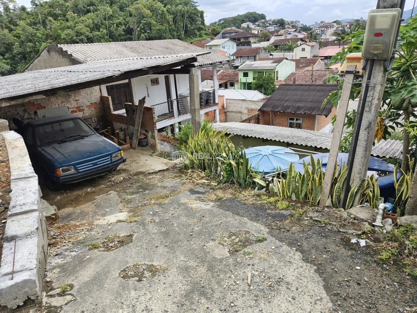 Terreno de 260,00m em declive com duas quitinetes alugadas. - foto 1