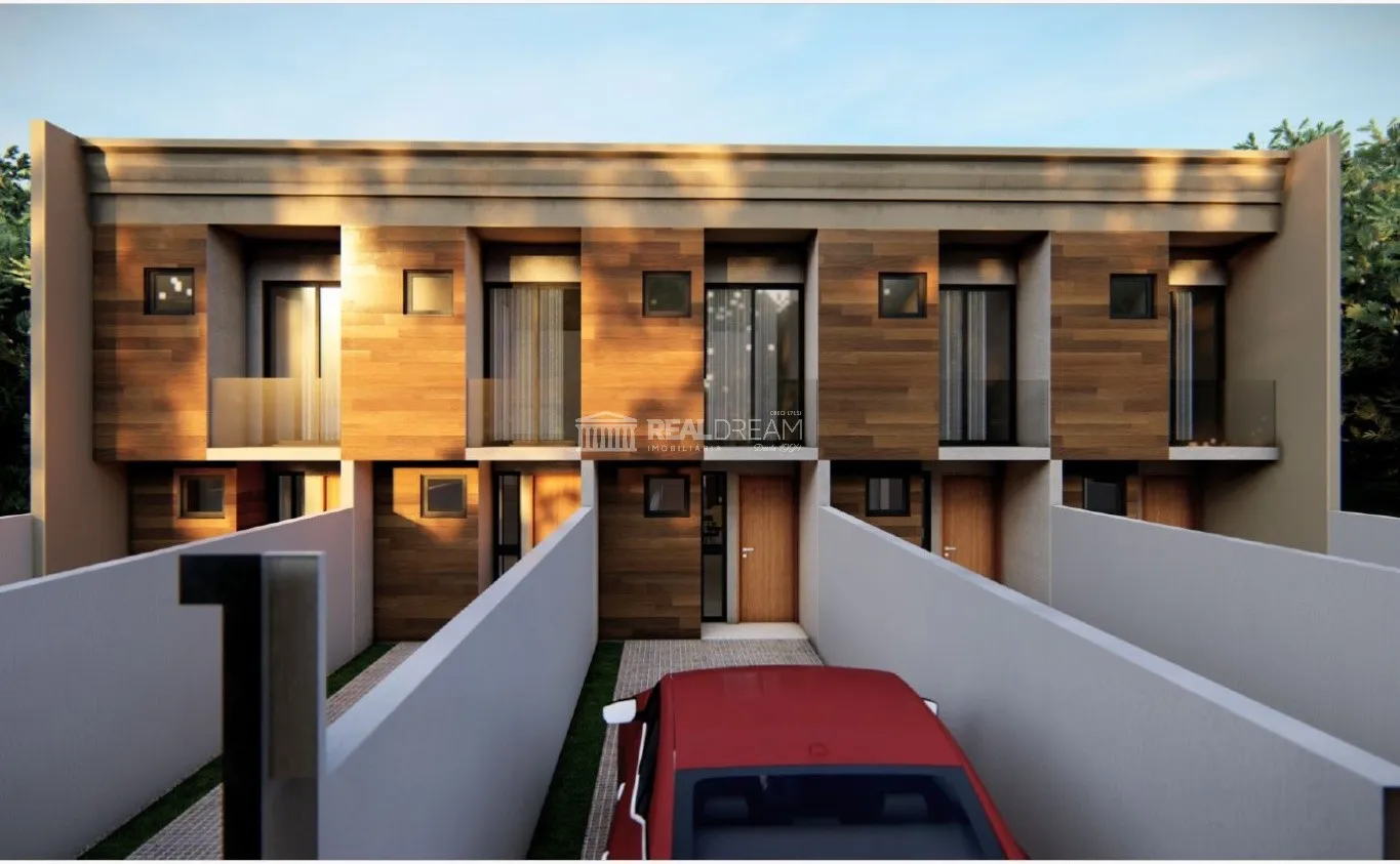 Sobrado com 2 suítes, 2 vagas de garagem e amplo quintal. - foto 1